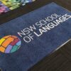 AMCO custom logo entry mat for the NSW School of Languages