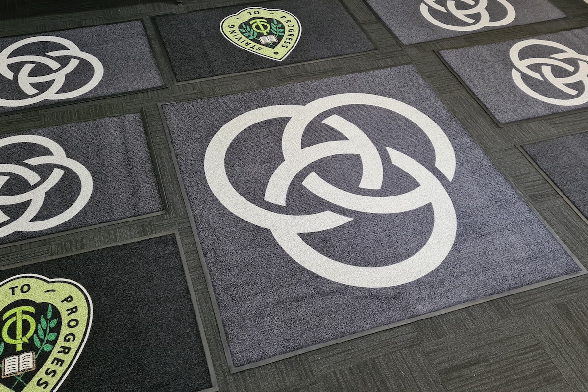 AMCO custom logo entry mat for a school