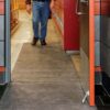 AMCO Pig Grippy Mat (Croc Mat) in use in a building entryway