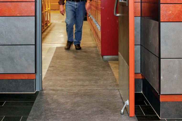 AMCO Pig Grippy Mat (Croc Mat) in use in a building entryway
