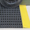 AMCO StrongGrip anti-slip mat close up with a wheel