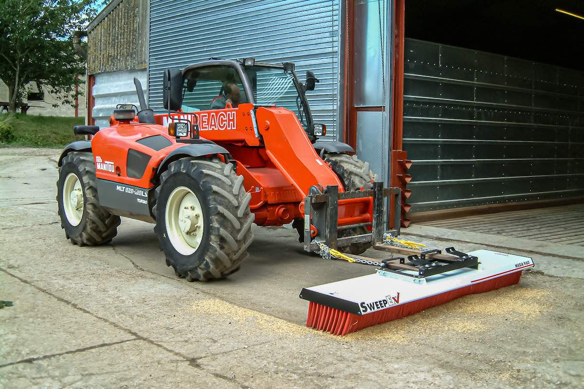 AMCO Sweepex Broom cleaning up sawdust or grains