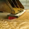 AMCO Sweepex Broom in use in a grain shed