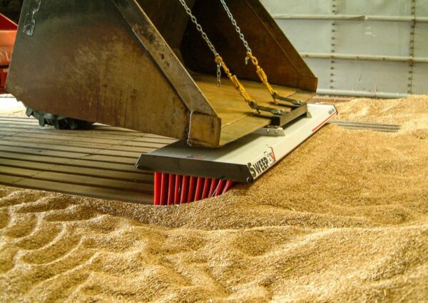 AMCO Sweepex Broom in use in a grain shed