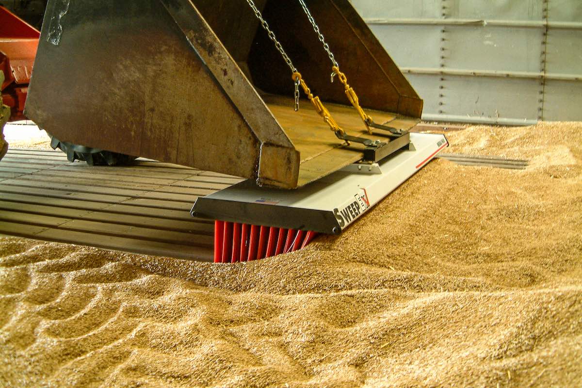 AMCO Sweepex Broom in use in a grain shed
