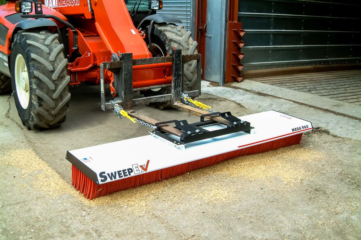 AMCO Sweepex Broom cleaning up sawdust or grains