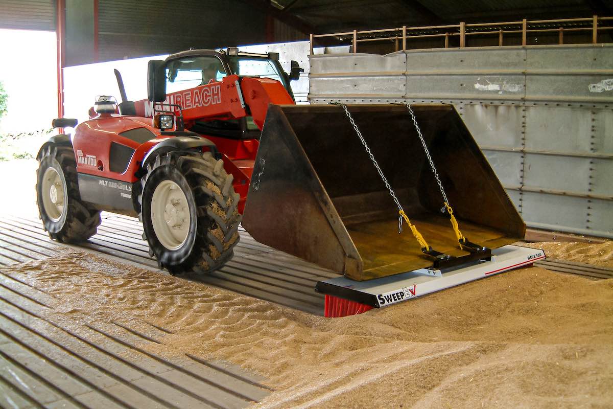 AMCO Sweepex Broom in use in a grainshed