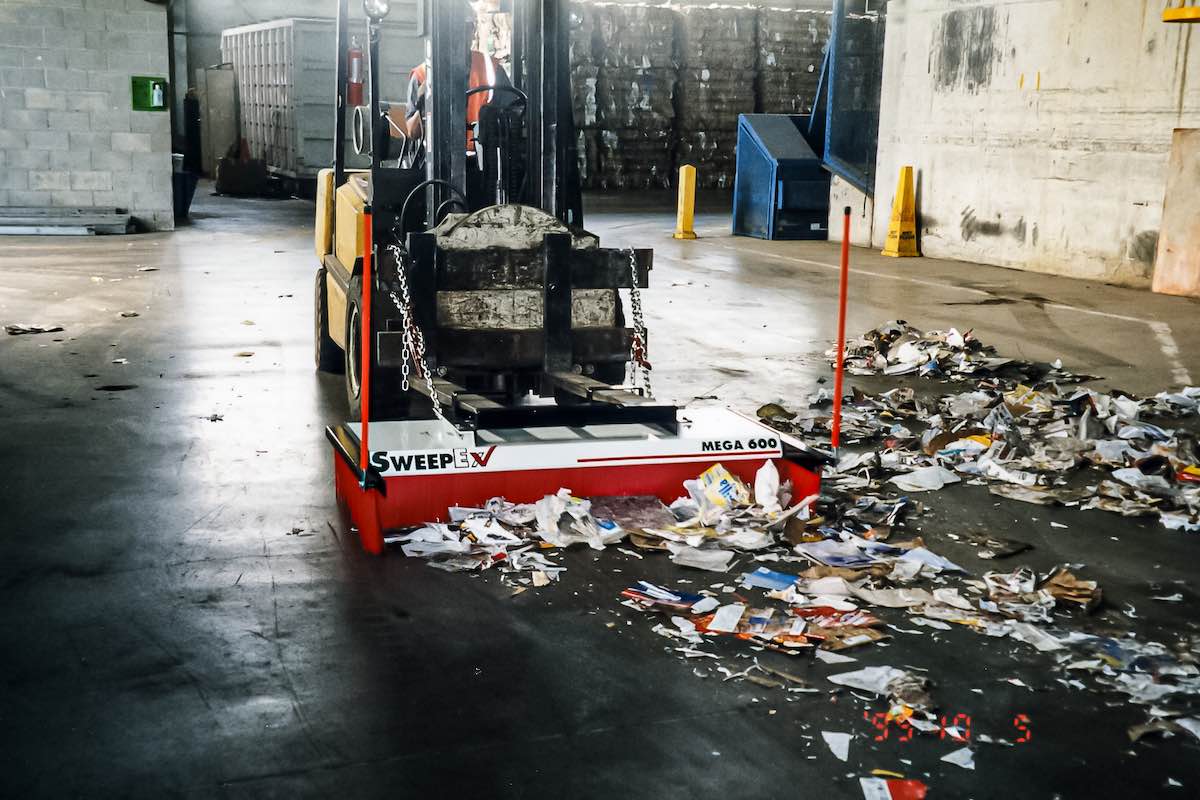 AMCO Sweepex Broom sweeping up warehouse rubbish